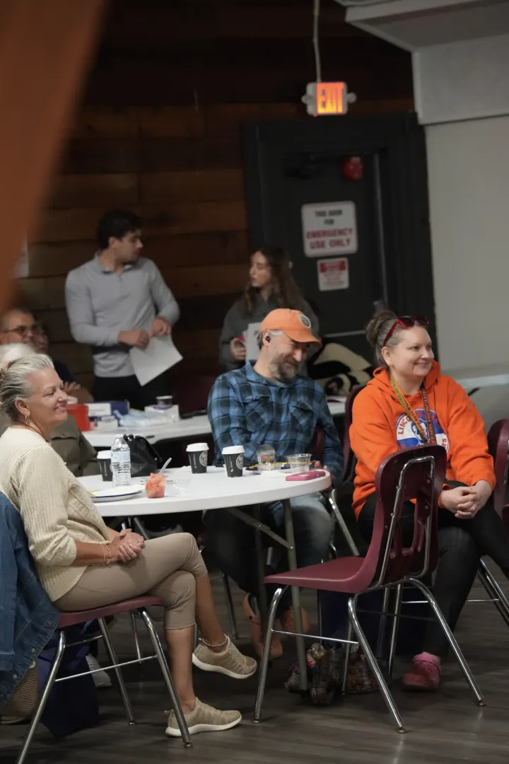 Guests listening at the community event