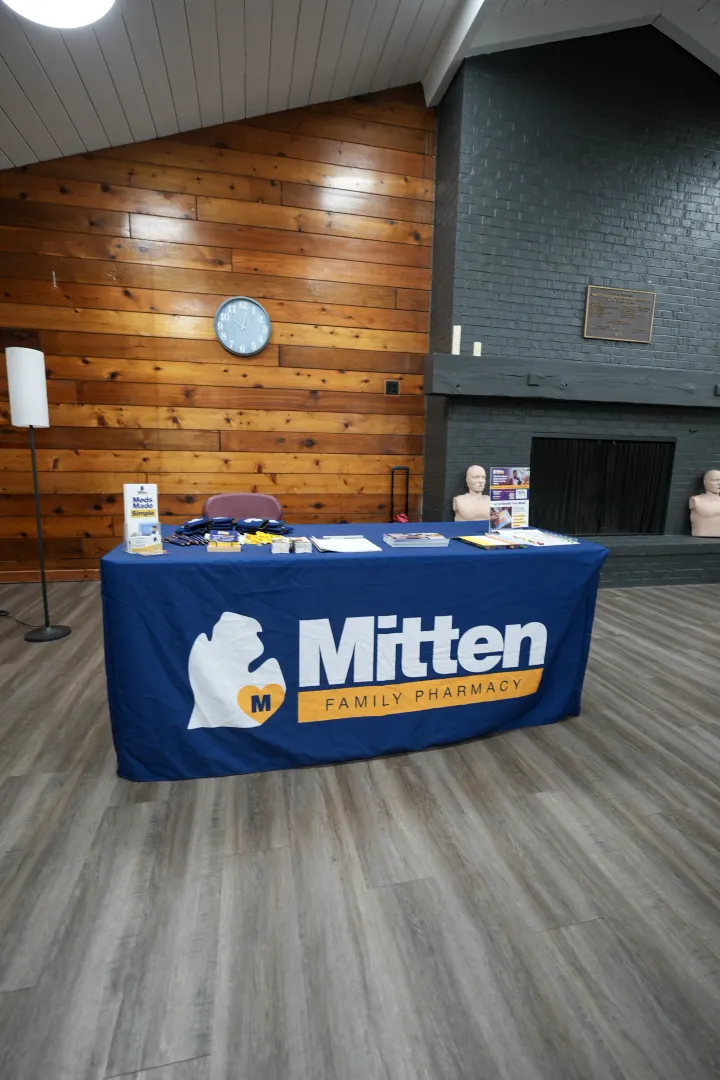 The Mitten Family Pharmacy table at a community CPR class